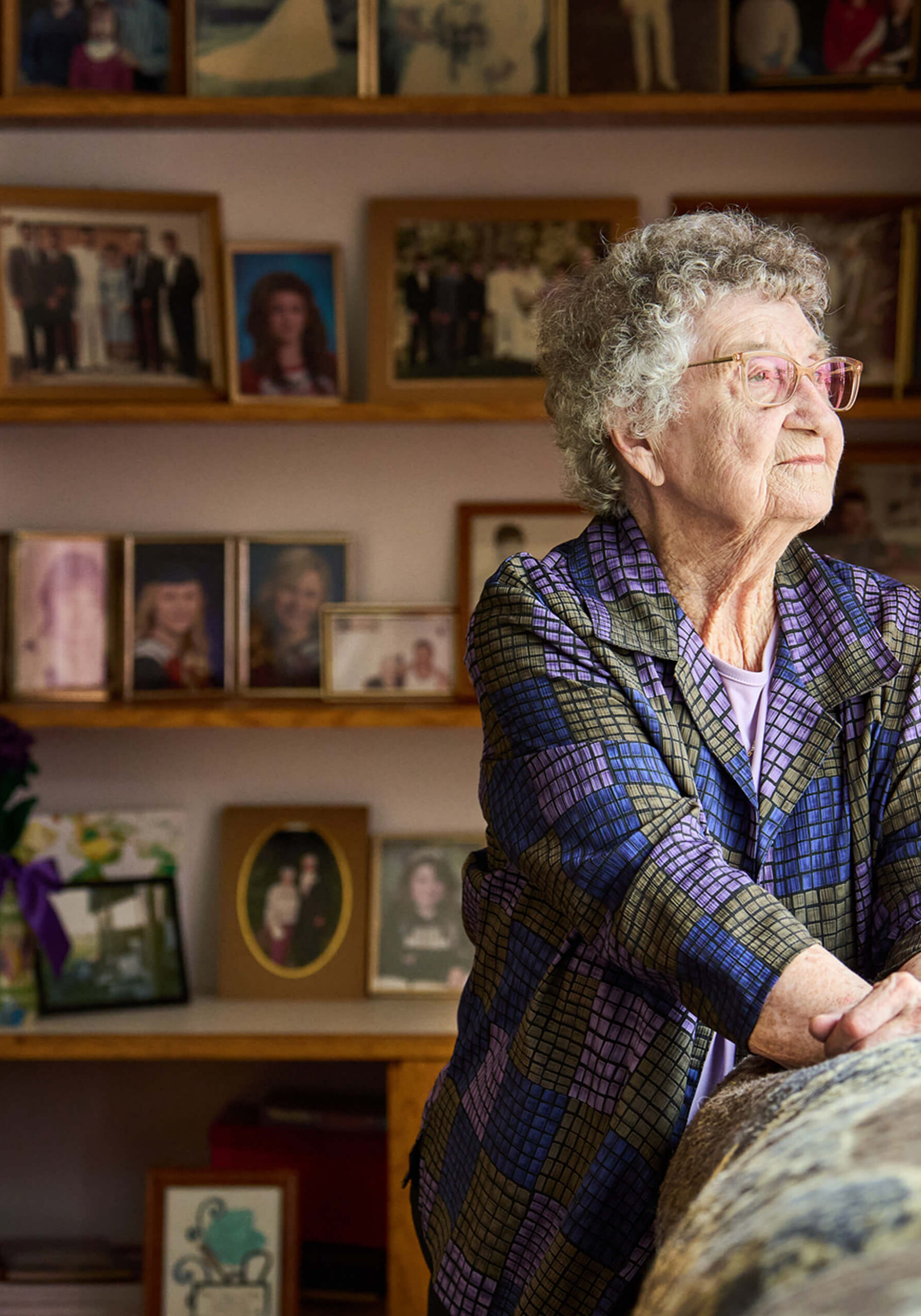 Senior woman with photo collection background